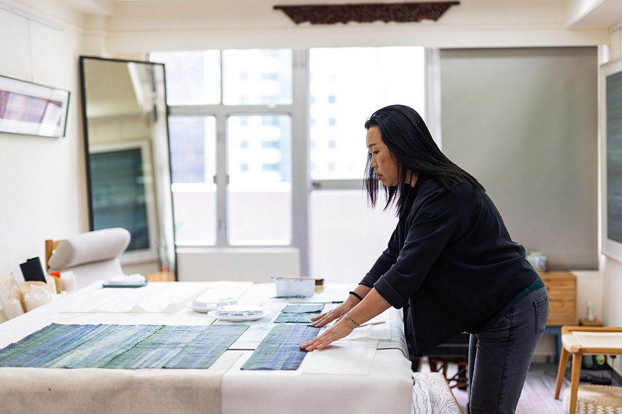 Artist Fan Yan at her table