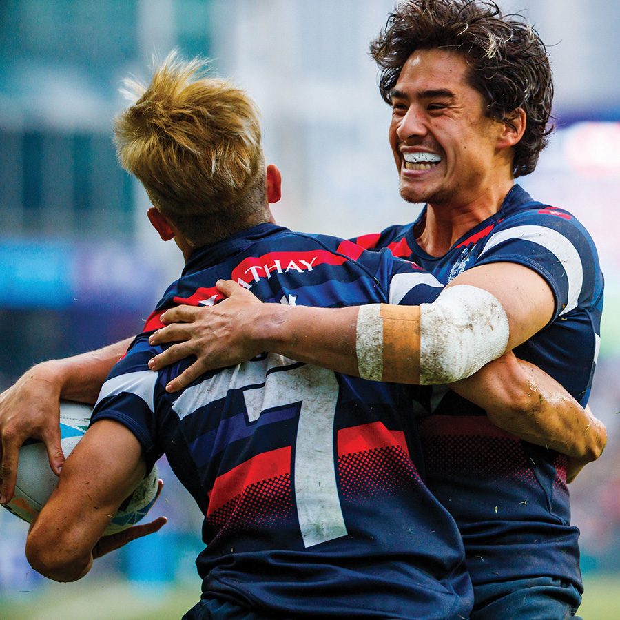 Players hug at the Hong Kong Rugby Sevens