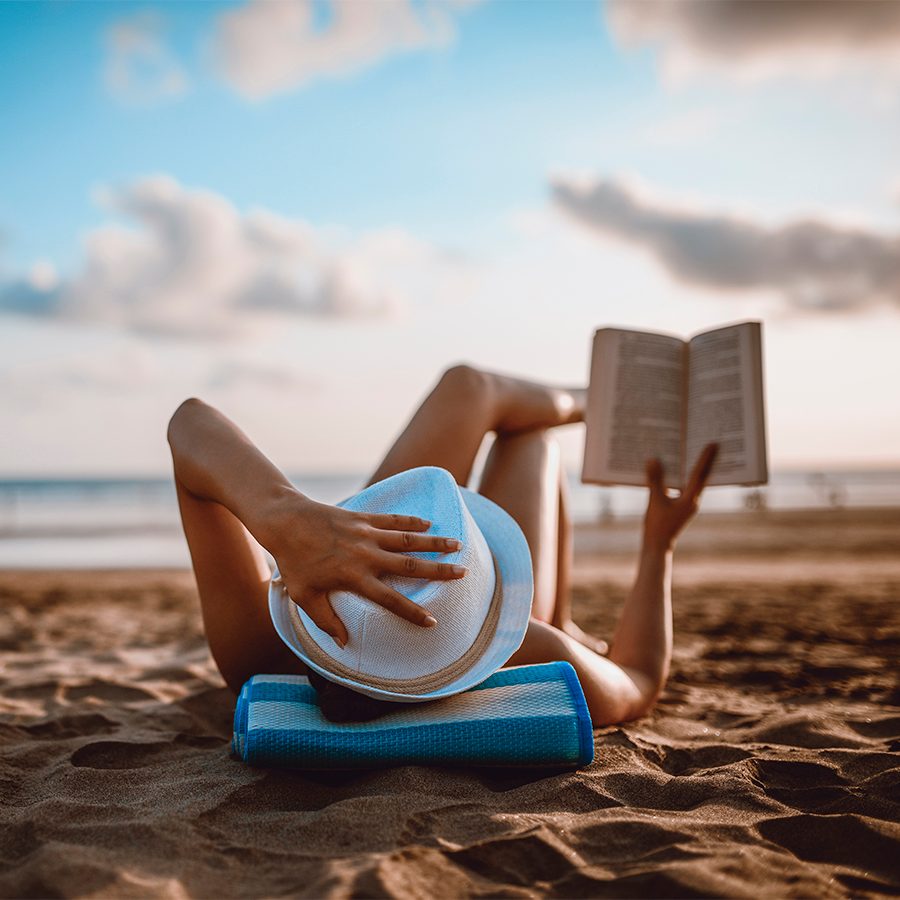 Woman reading on beach
