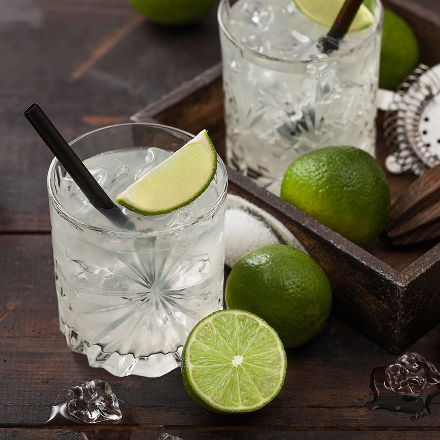 Cocktail with limes on the side