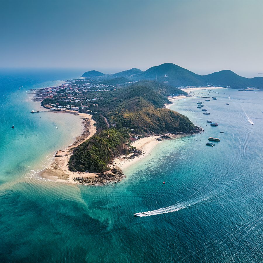 Aerial shot of a Thai peninsula sloping into beaches on all sides