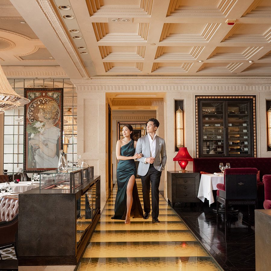Man and woman walking into restaurant