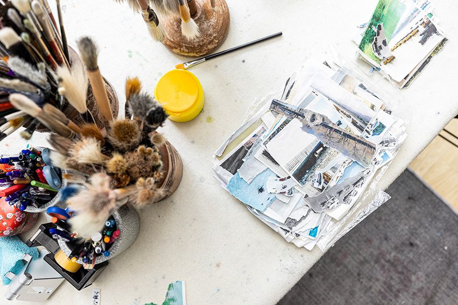 A photo taken from a bird's eye view with lots of painting tools.