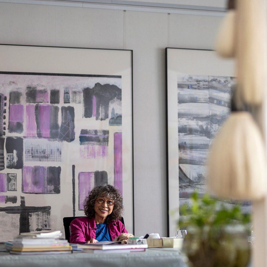 Nina Pryde is sitting and looking at the camera