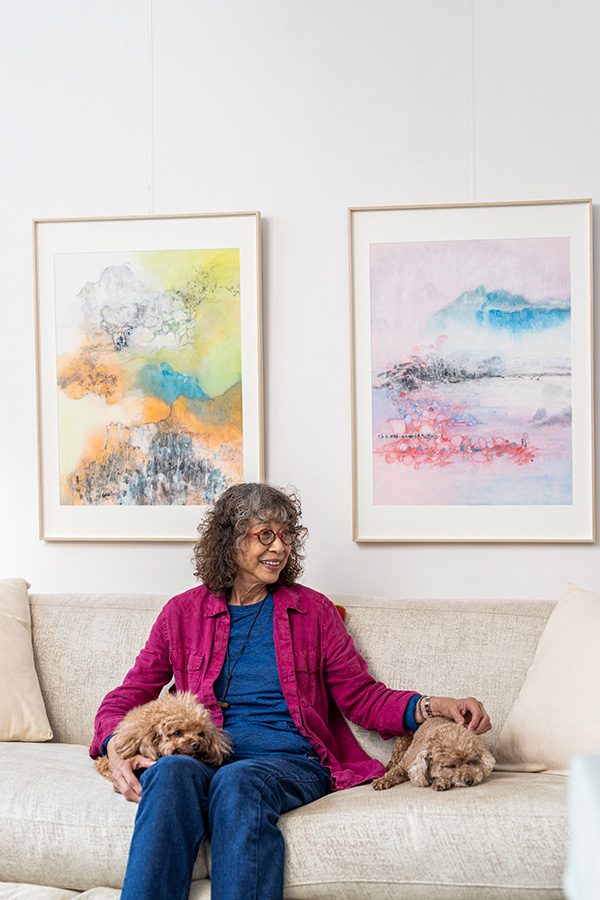 A photo of Nina Pryde is sitting with her pets