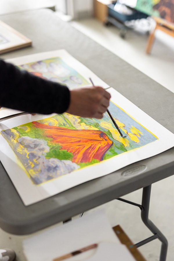 Artist Stephen Wong at work on one of his art pieces