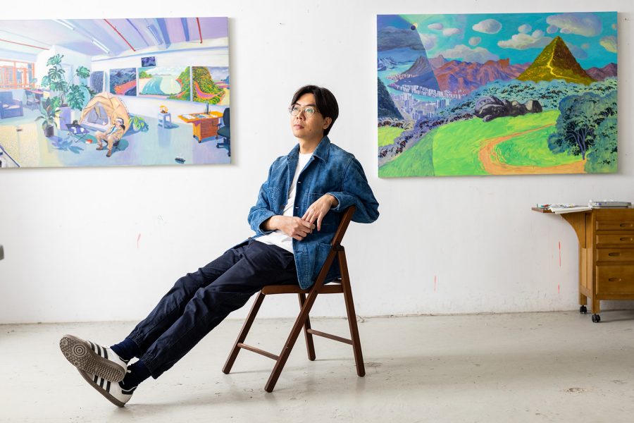 Gallery in the skies artist, Stephen Wong sitting in art studio