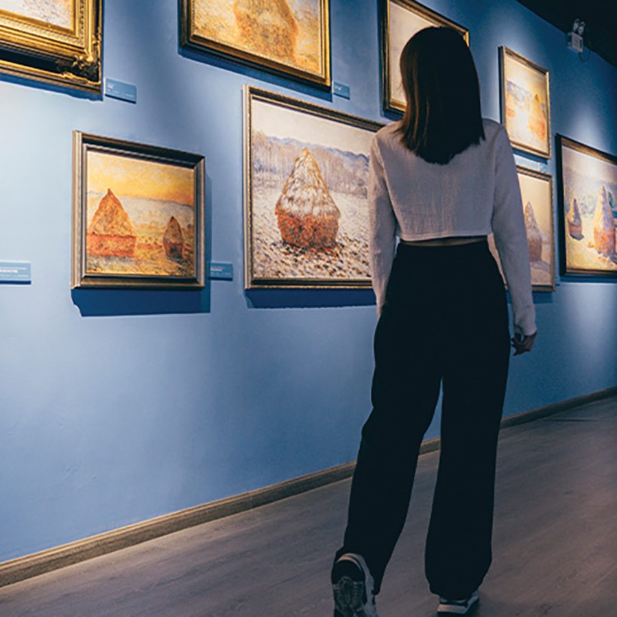 Woman looking at art