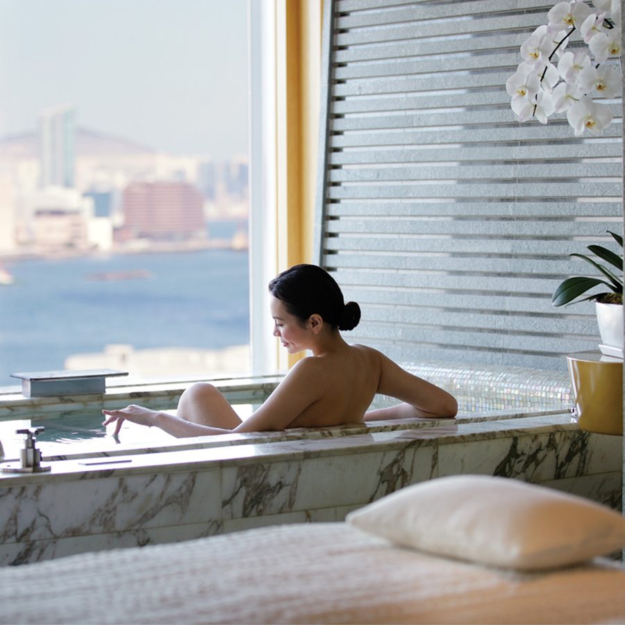 Woman in bath at four seasons hotel hong kong