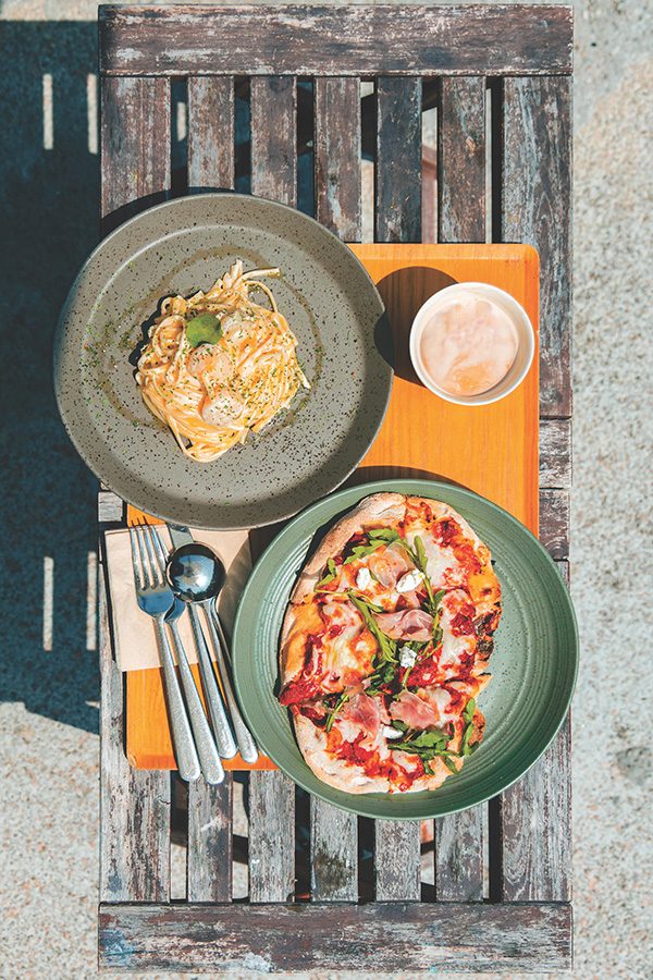 Food and coffee on a bench