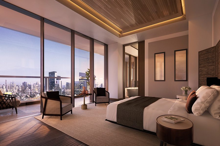 Aman Nai Lert Bangkok's bedroom has floor-to-ceiling glass as well as a single bed and sitting area.