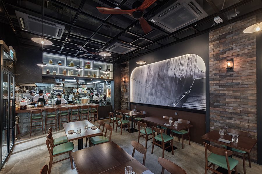 AERA's dining area interior presents a modern design and open kitchen