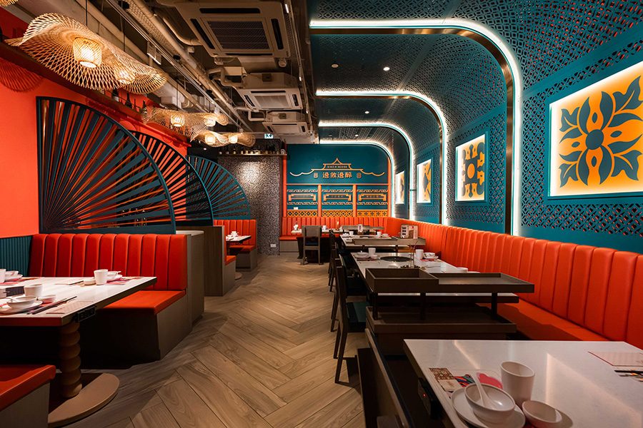 Interior of Bino N Booze dining area with vibrant colors, modern decor, and stylish seating
