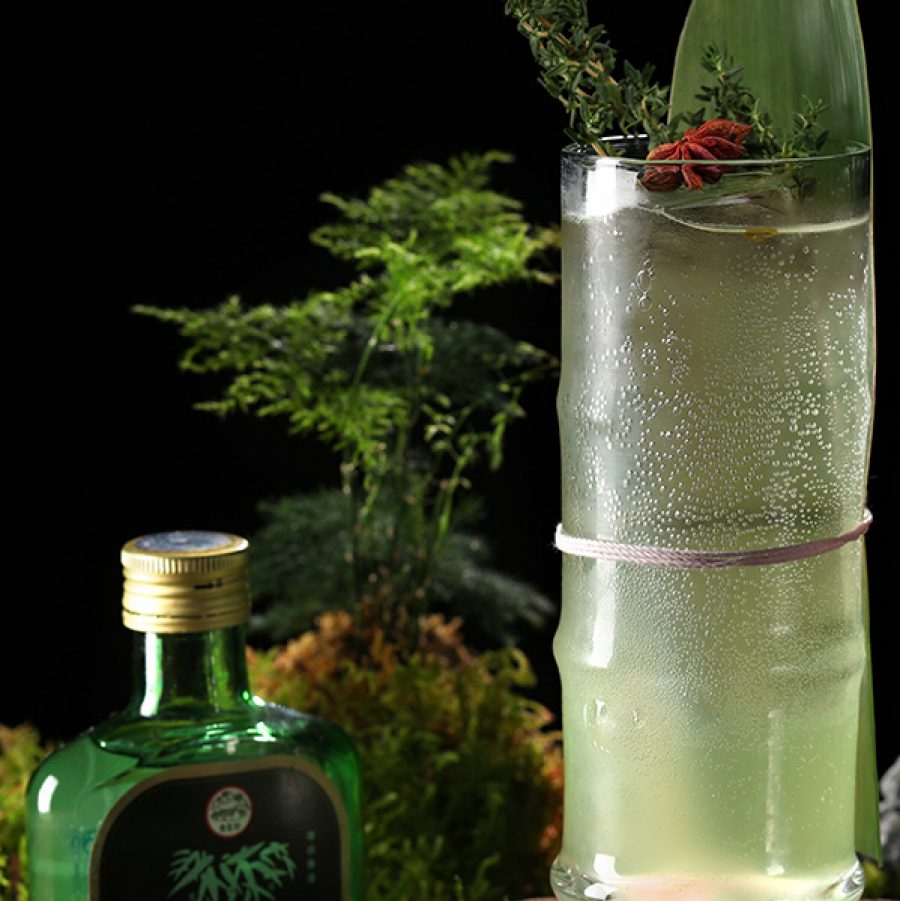 Chinesology vibrant green cocktail drink in a highball glass