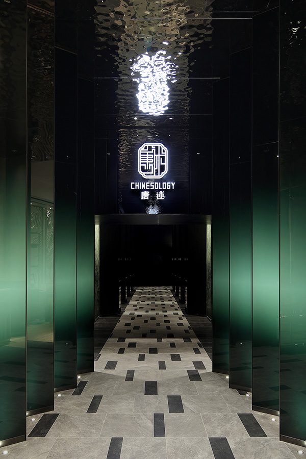 Chinesology corridor fitted with modern black and green panels