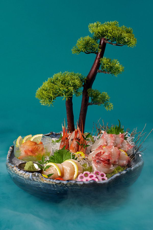 An artistic plating of sashimi platter by Bino N Booze