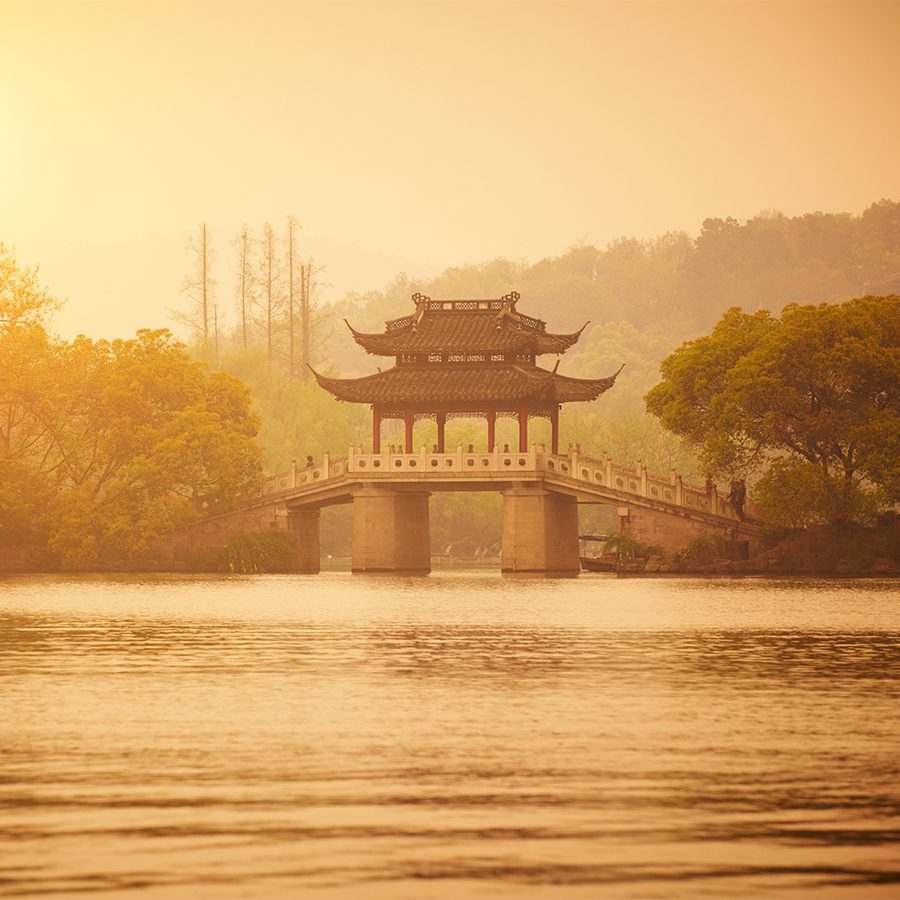 View of the West Lake in Hangzhou at dusk.