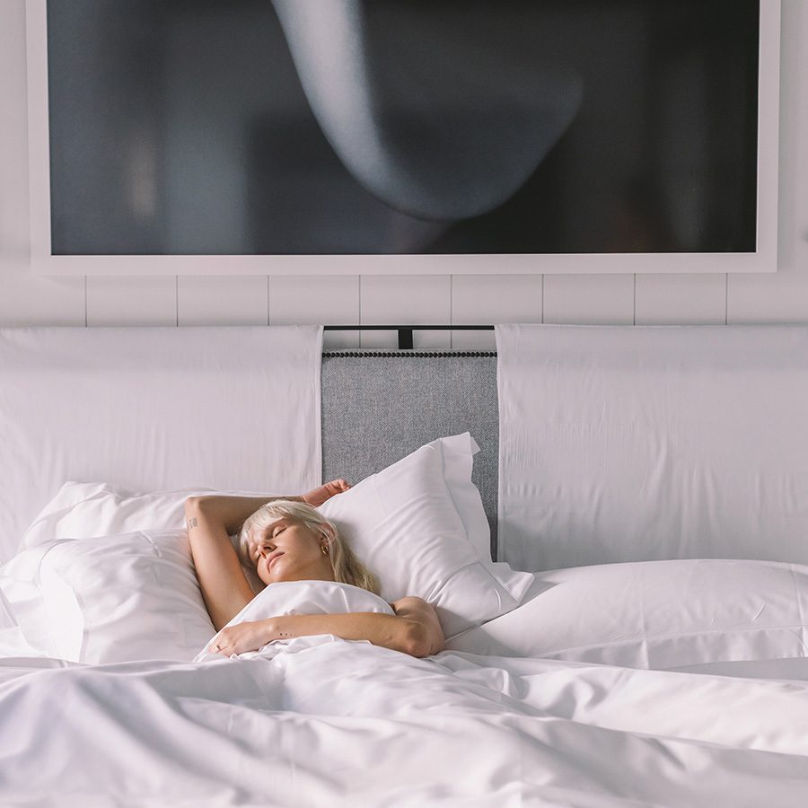 A lady is sleeping at a bed of Seventy