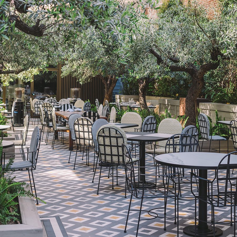 Seventy Barcelona chairs outdoors.