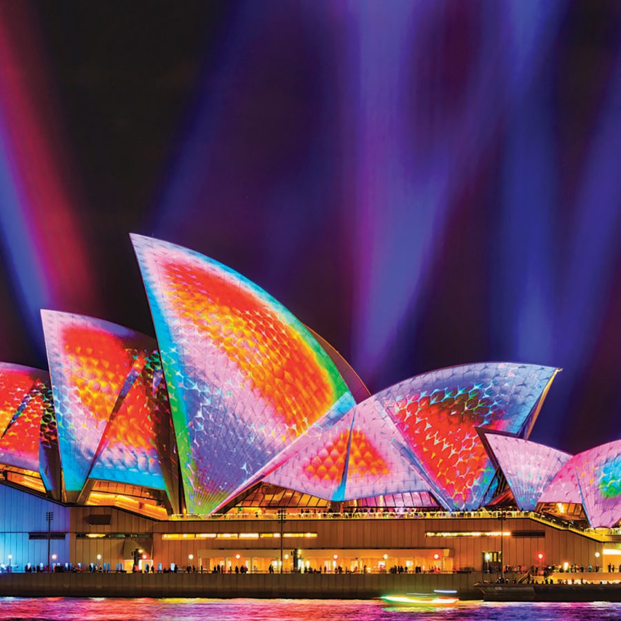 Sydney Opera house lit up with rainbow colours 