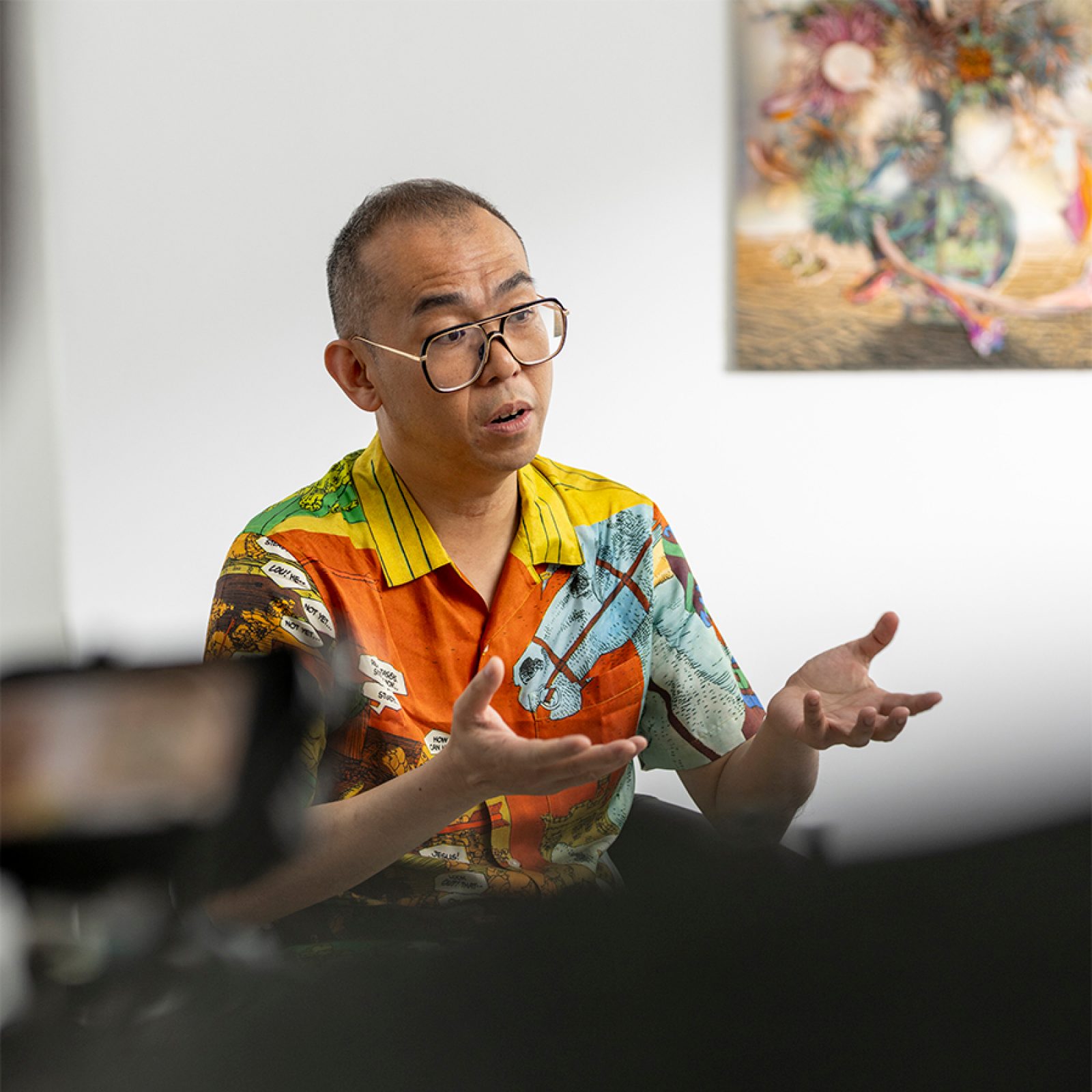 Artist Gordon Cheung having an interview in a studio