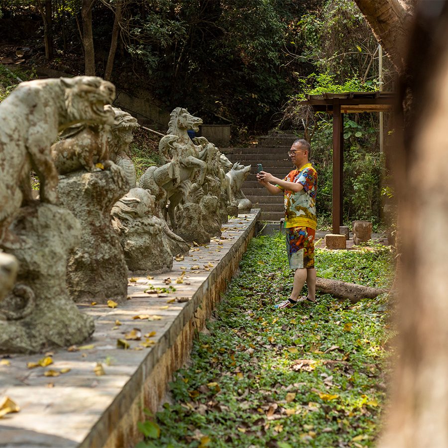 Artist Gordon Cheung snapping a photo at Lung Yeuk Tau, Fanling