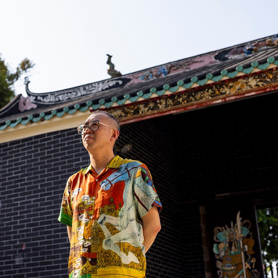 Artist Gordon Cheung standing in front a building in Lung Yeuk Tau, Fanling