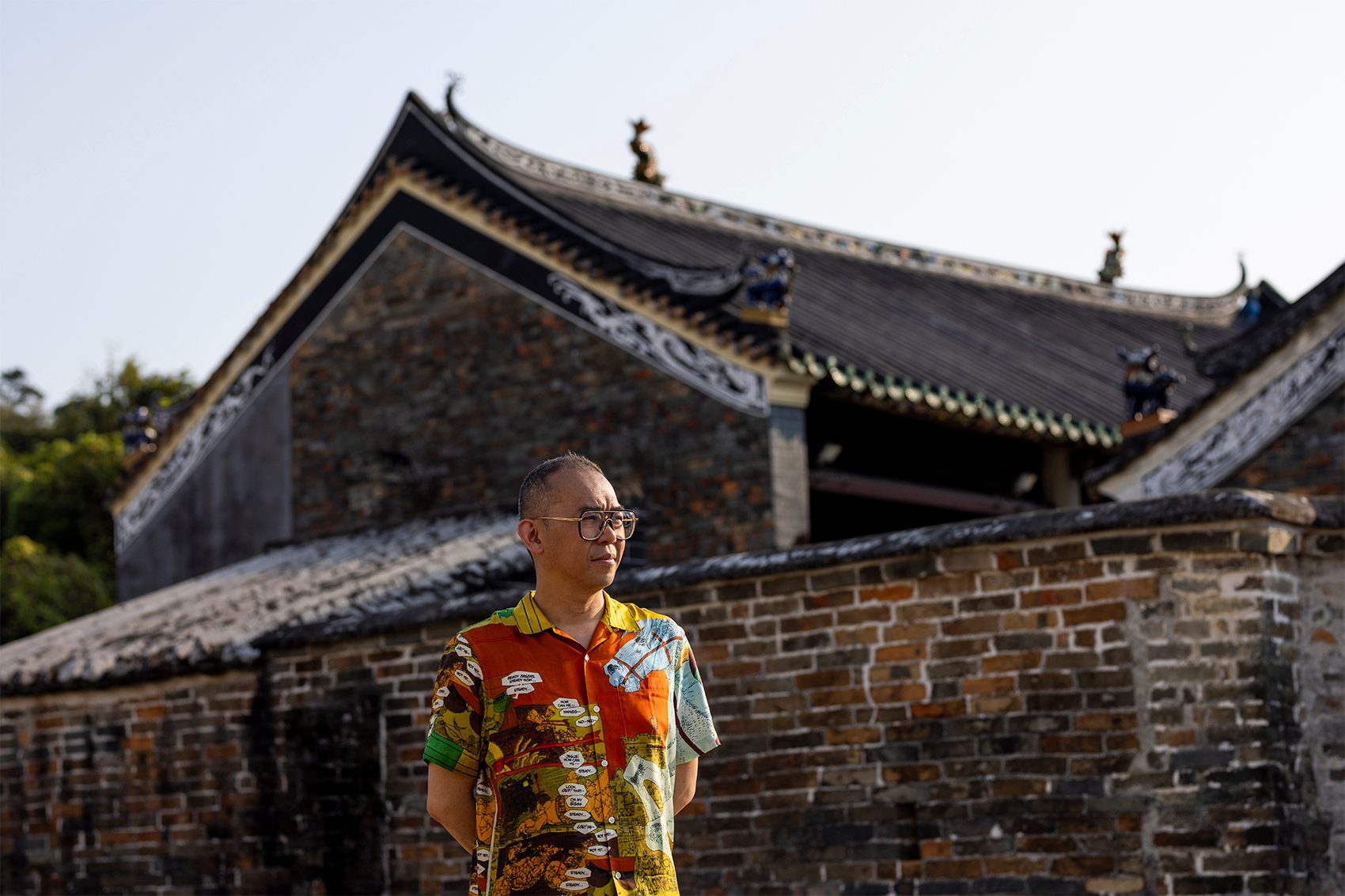 Gallery in the skies artist Gordon Cheung standing on Lung Yeuk Tau Heritage Trail, Fanling