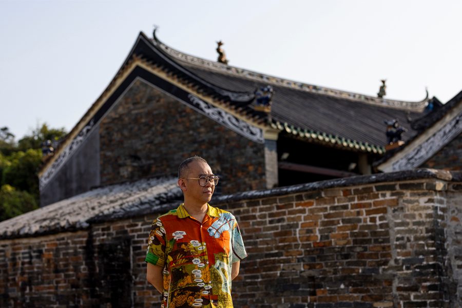 Gallery in the skies artist Gordon Cheung standing on Lung Yeuk Tau Heritage Trail, Fanling