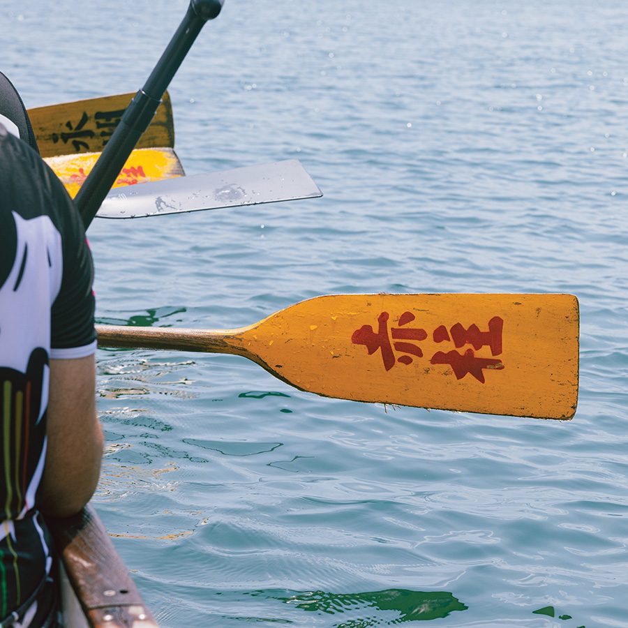 The word Stanley printed on a dragon boat paddle