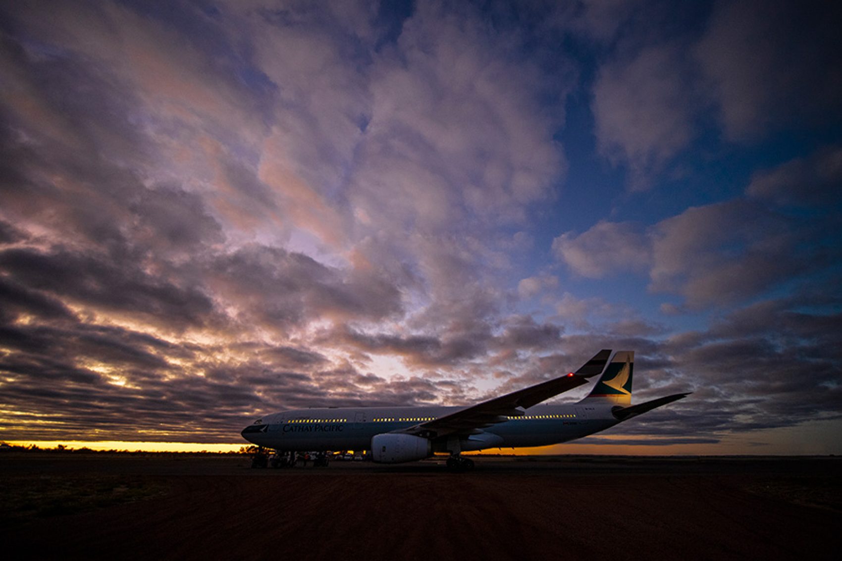 A photo of an airplane with many cloud