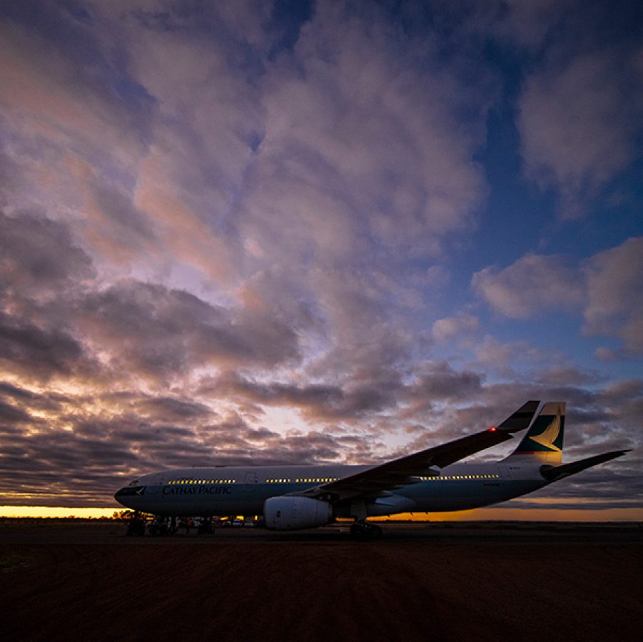 A photo of an airplane with many cloud