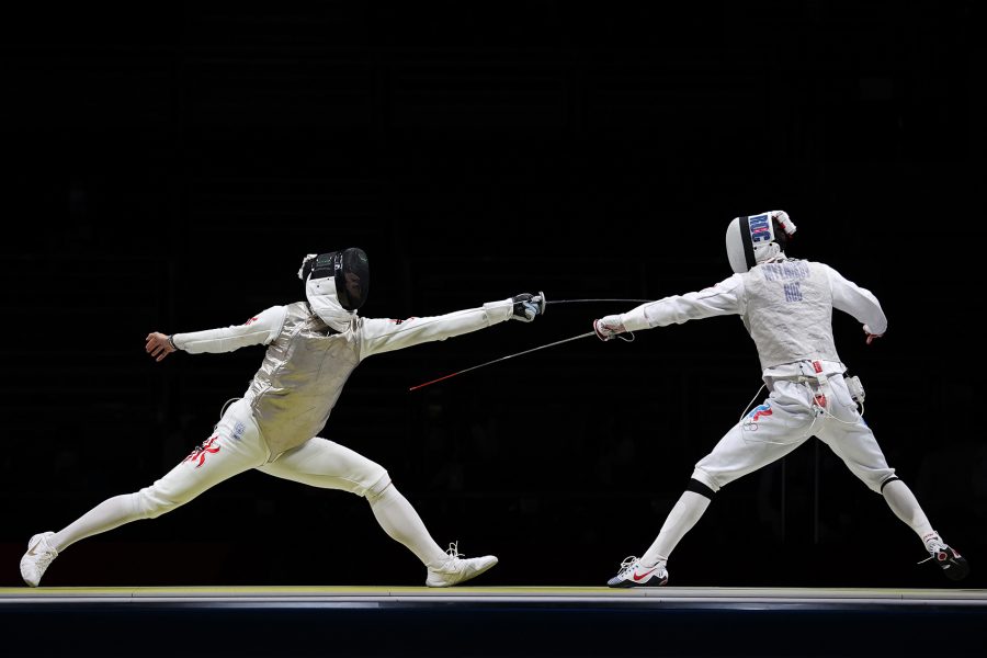 Two men are fencing in Olympics