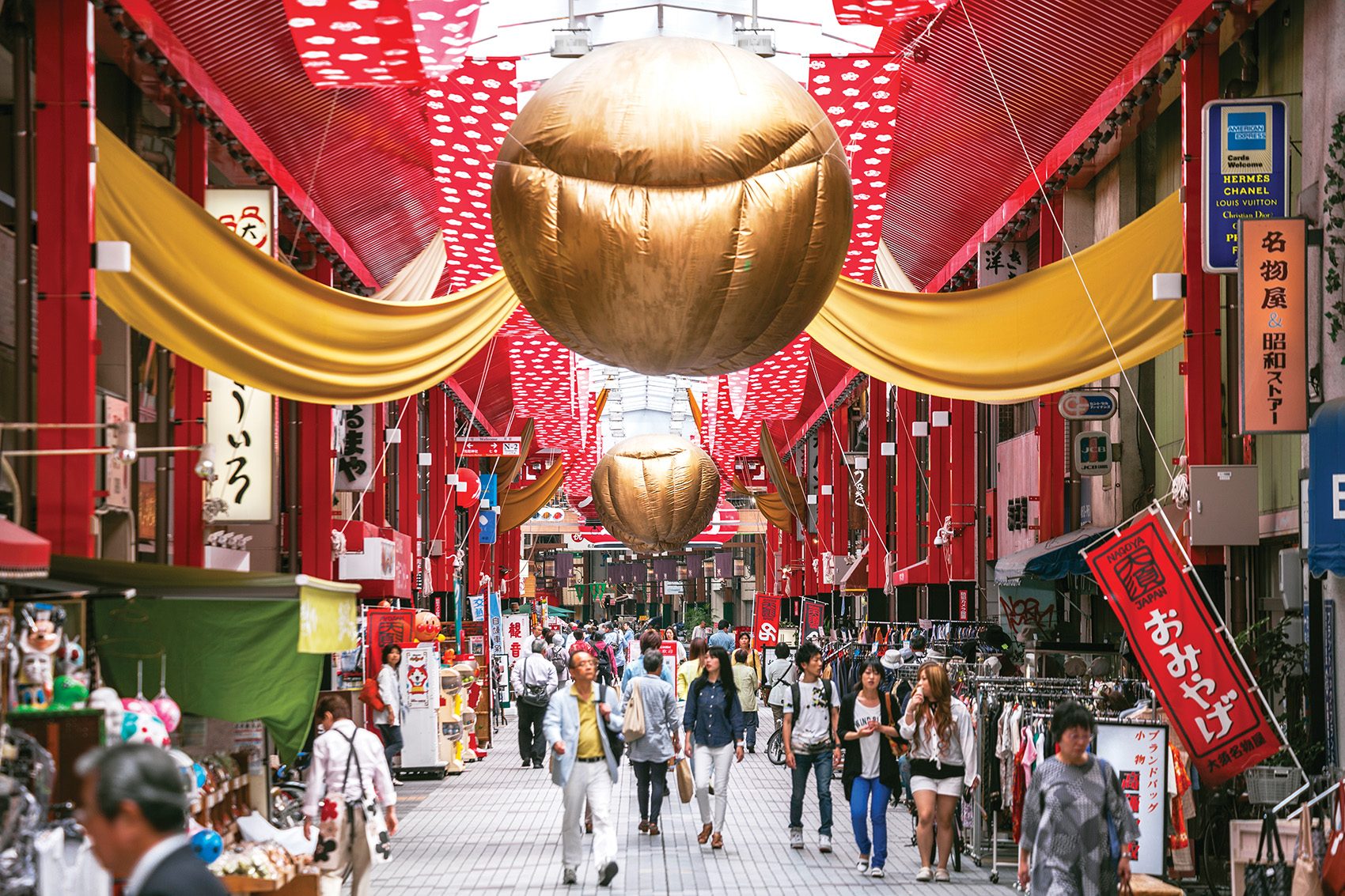 Pedestrians walk along Qilou Old Street in Haikou, Hainan.