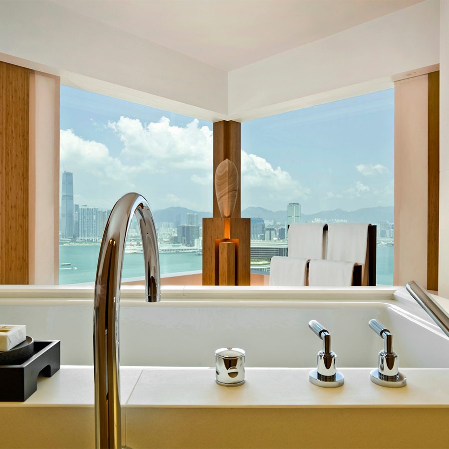 An interior photo of bathroom at the Upper House with a tub and sea view