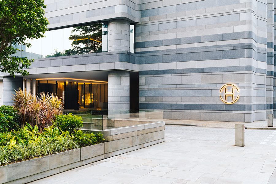 An exterior of The Upper House's logo