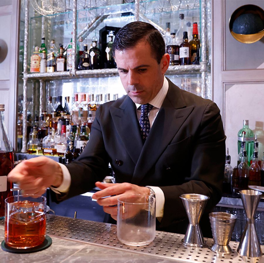 The Connaught Bar's Ago Perrone is mixing drinks.