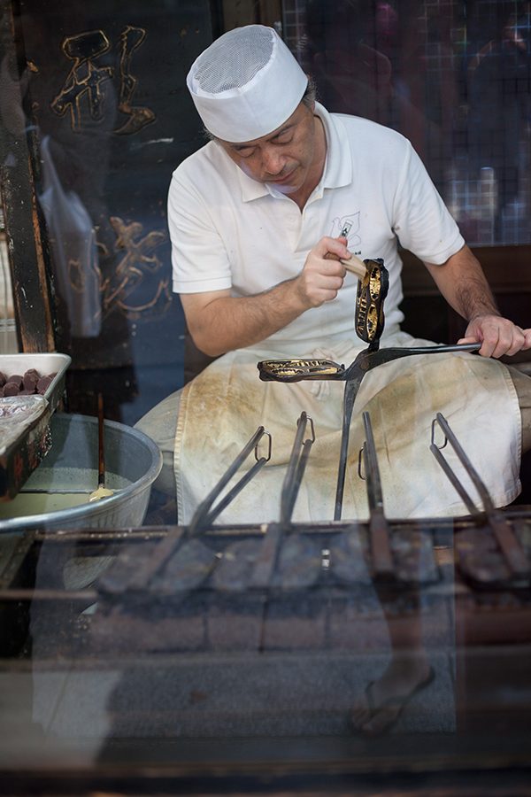 A Japanese is making a Ningyo yaki cakes