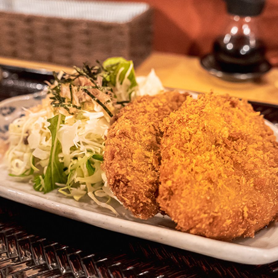 Minced meat culet on a plate with shredded cabbage