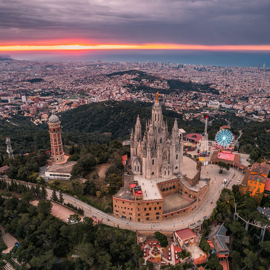 Aerial view of Barcelona skyline with Sagrat Cor temple