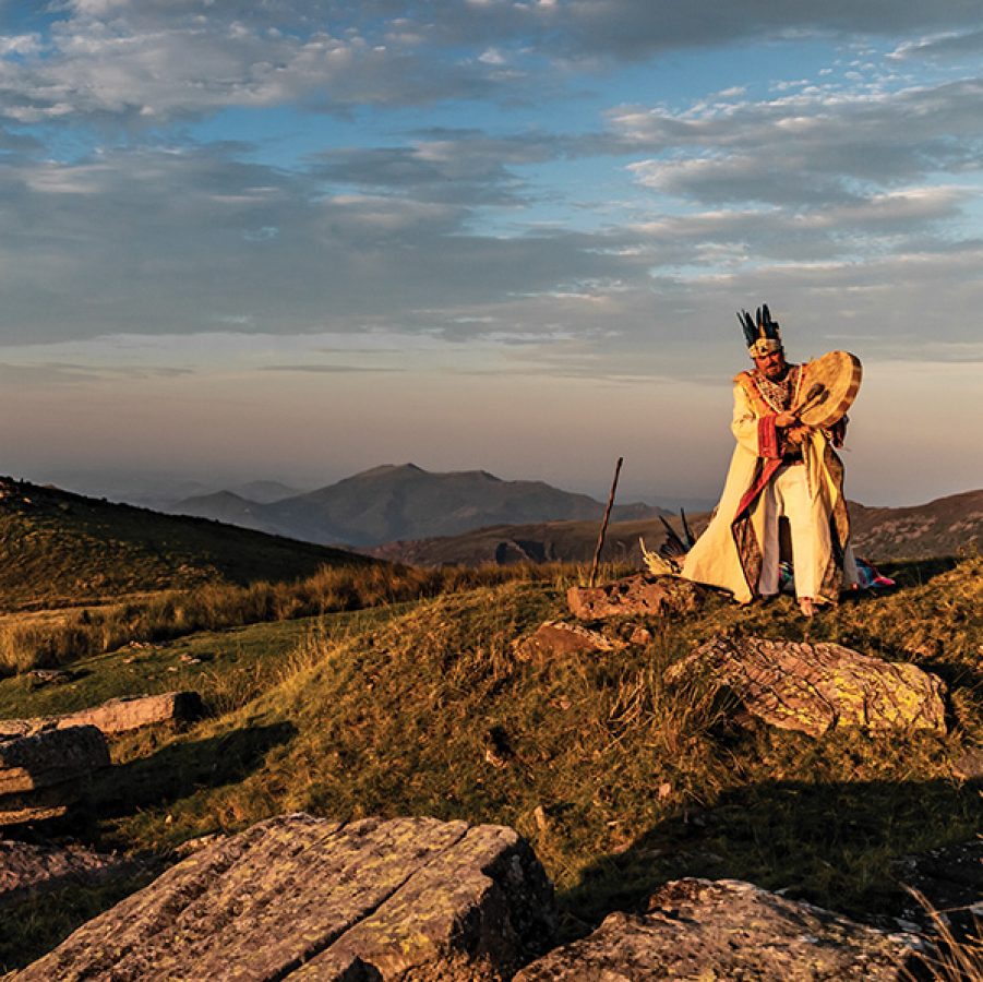 A man on a hill on a Wisdom Quest adventure