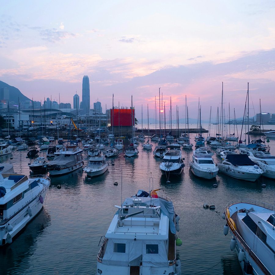 Many yachts are docked in Victoria Harbour, Hong Kong.