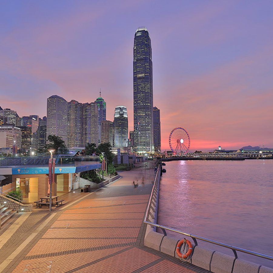 Tamar Park in Central under a purple evening sky.