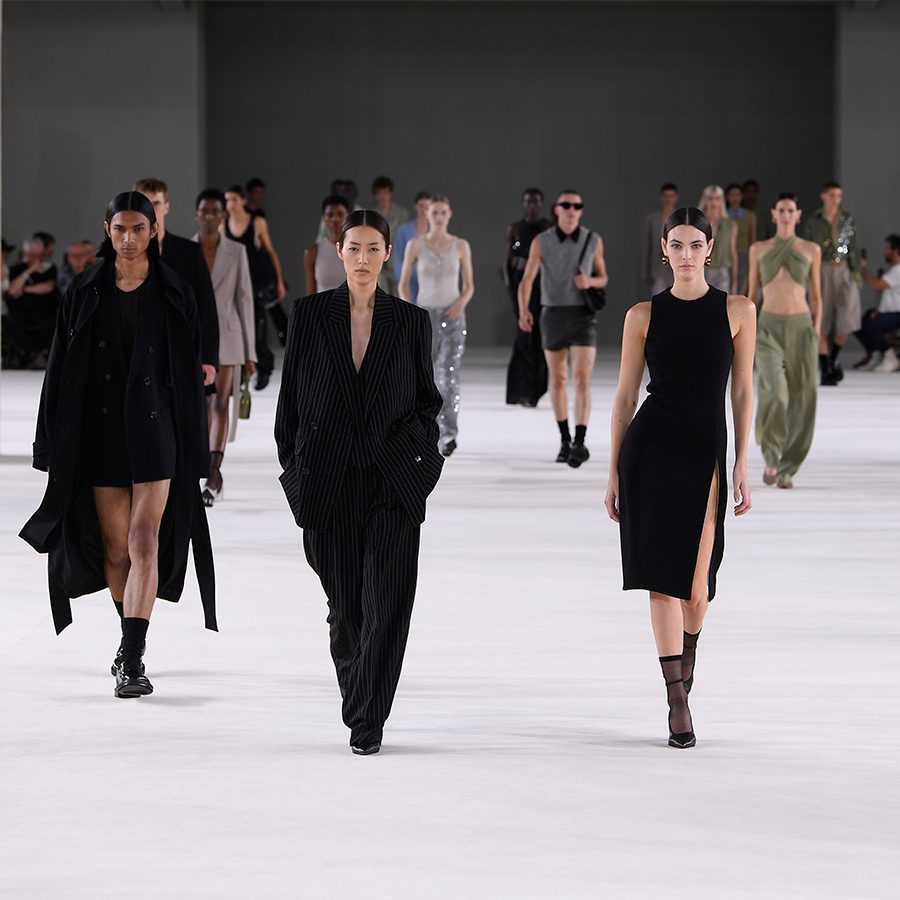 Models are walking runway at Ami's Paris Spring 2024