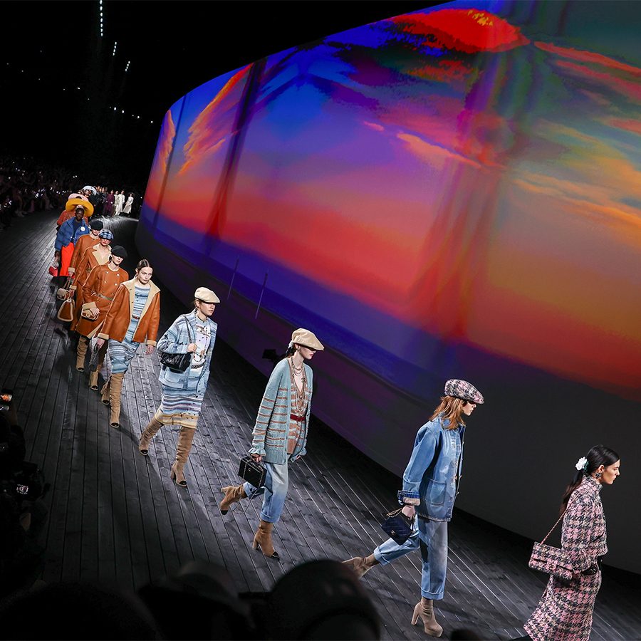 A line of models walking at the Chanel runway at Paris Fashion Week 2024