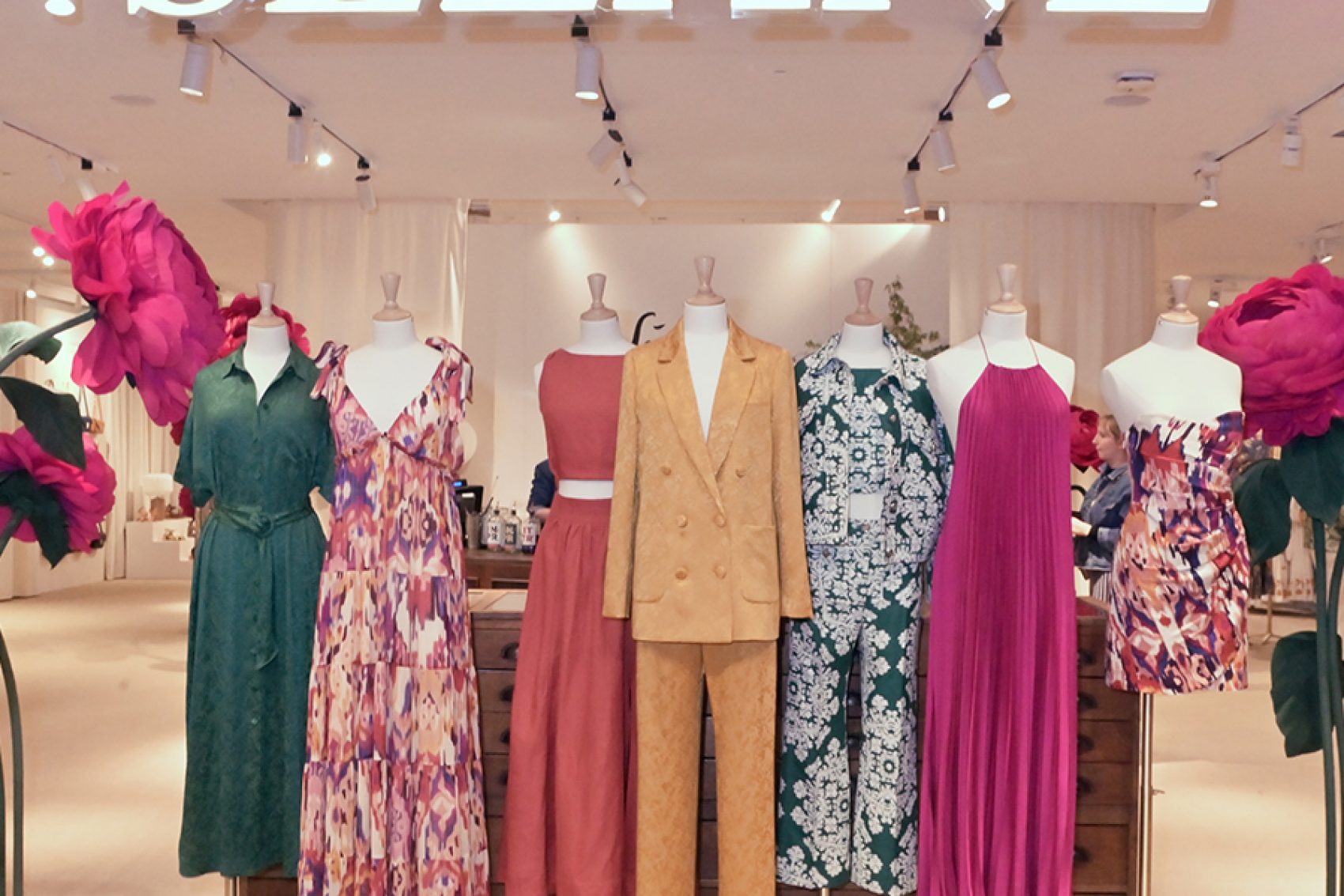 A collection of Sezane designer clothes on display at Le Bon Marche in Paris, France