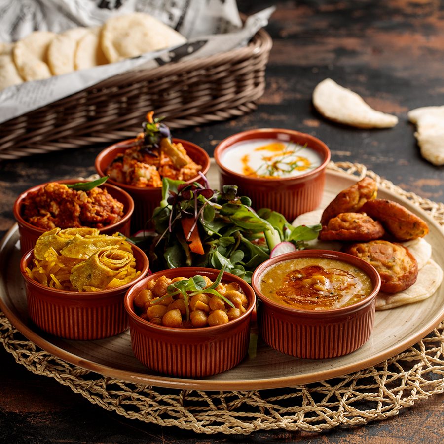 A photo of breakfast set with hummus in Bahraini
