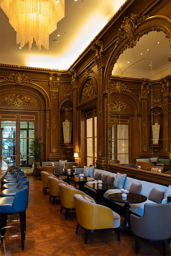 A view of the elegant interior and large mirror of Bar Kléber in Paris, France