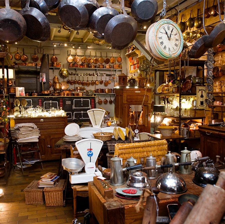 A photo inside of Les Puces, a vintage shop flea market in Paris, France