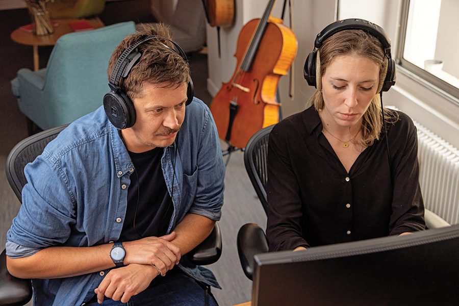 Two people listening to music
